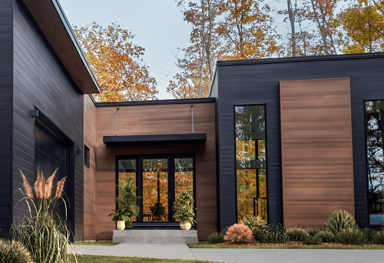 Façade d'un maison contemporaine avec revêtement métallique imitation bois